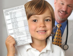 Boy holding Immunization Record