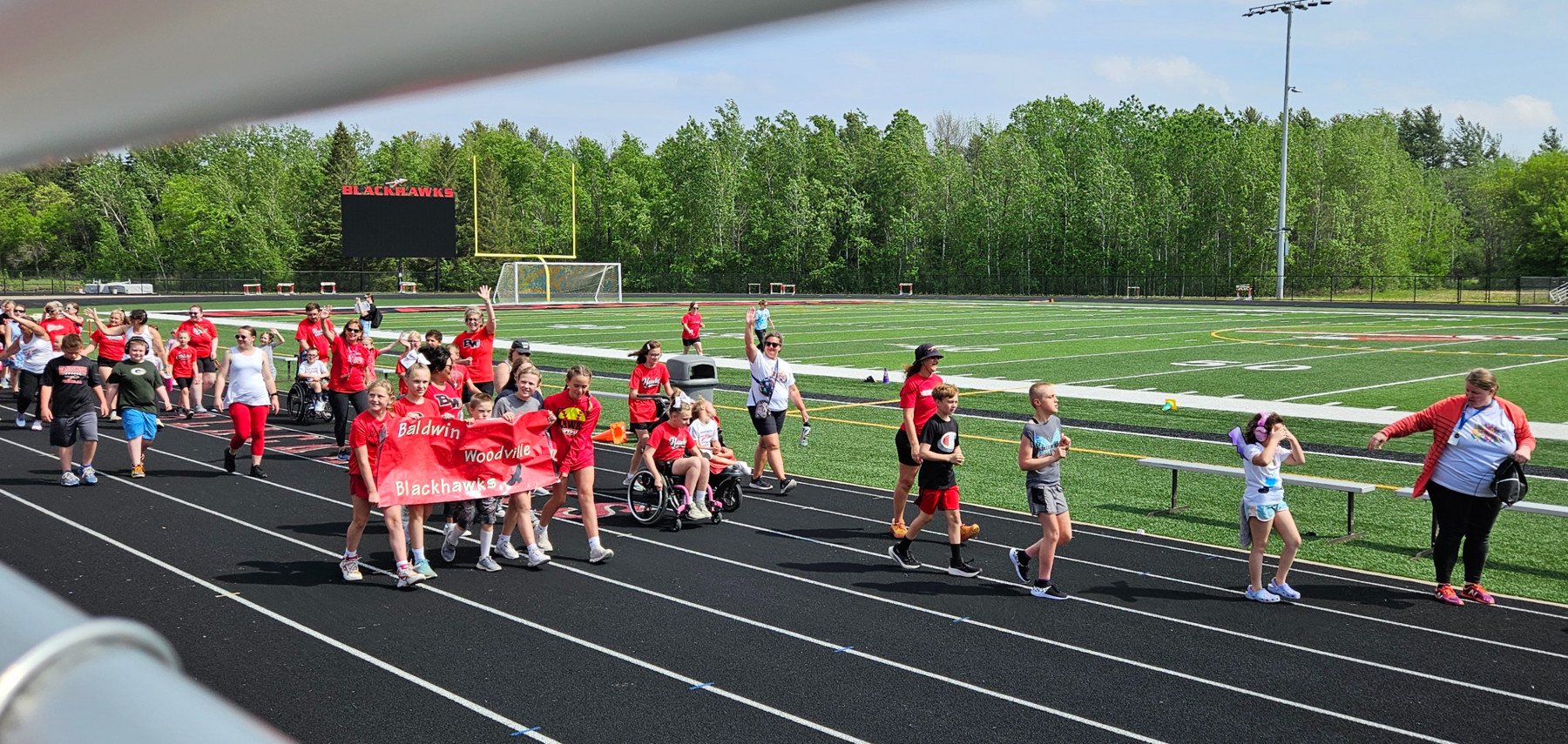 Students walking on a track.